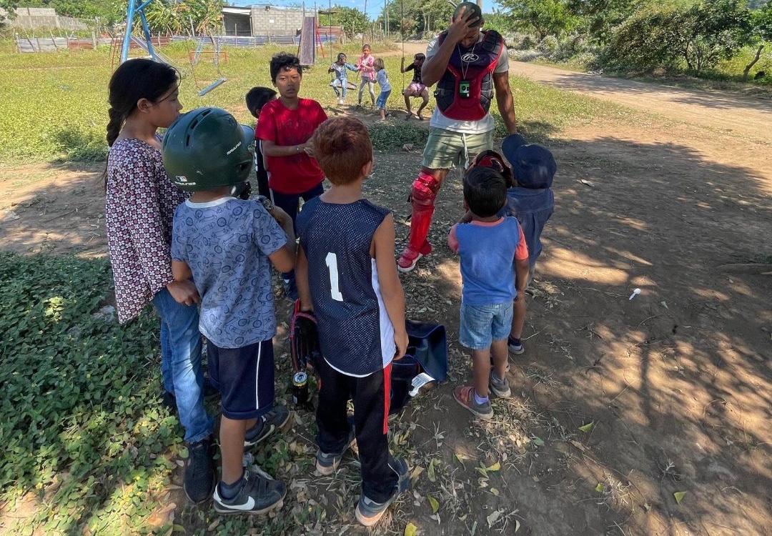 Handing out equipment to young players